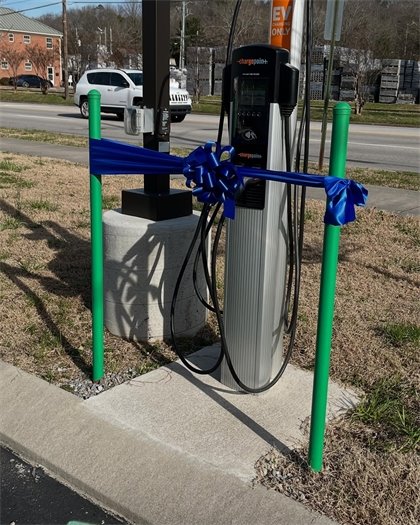 a ribbon cutting to celebrate the EV Charging Stations 